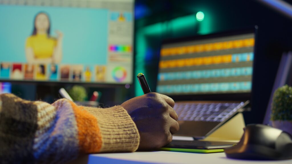 Professional man in creative setup at home uses digital tools for graphic design